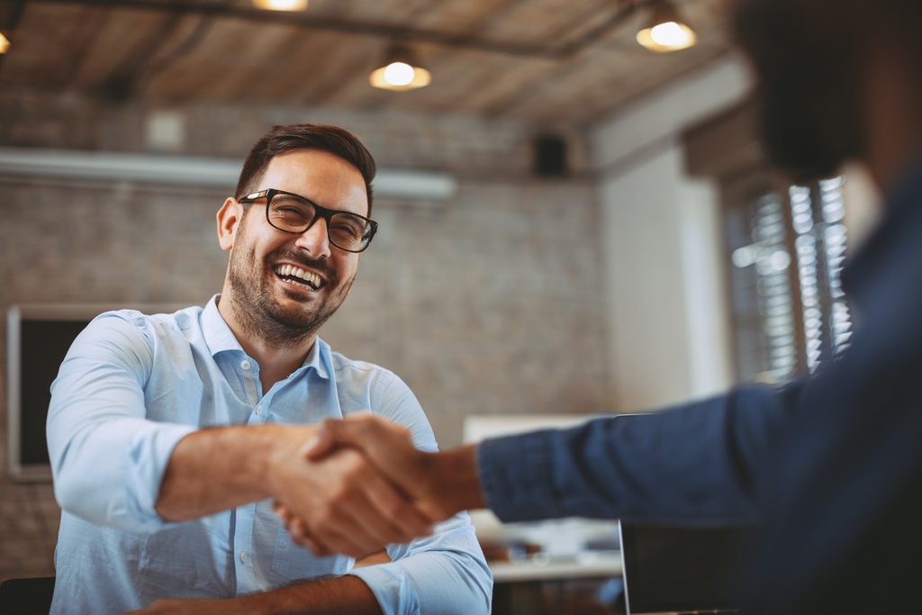 a business handshake between two people